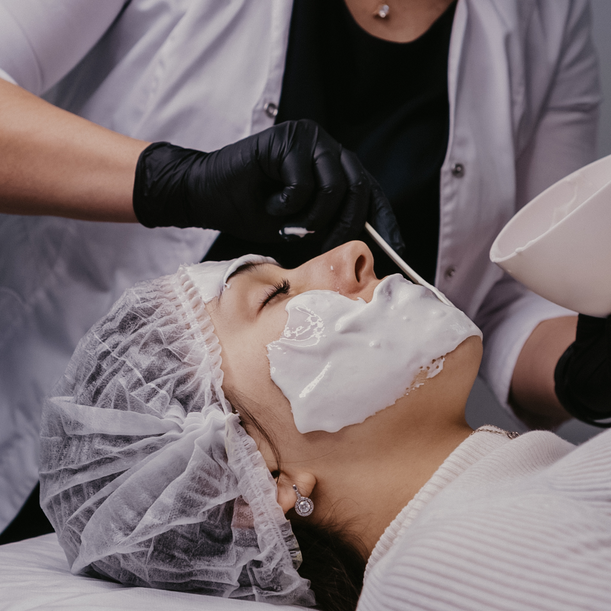 woman laying down getting a hydrojelly facial